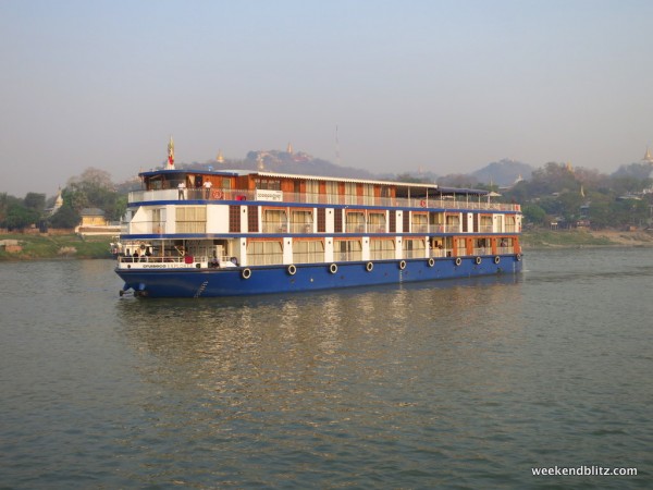 Cruise boat with overnight cabins headed towards Mandalay